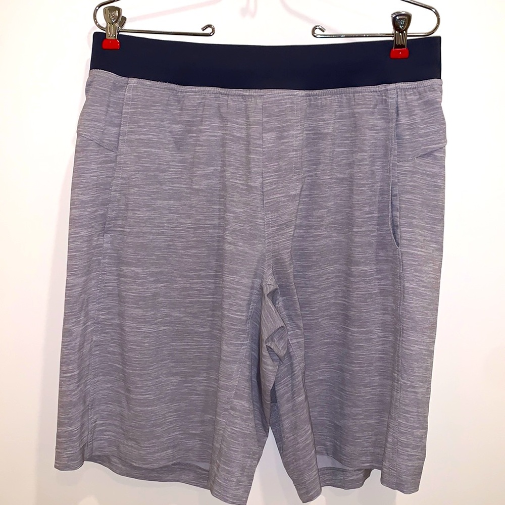 Lululemon shorts. Heathered grey w/navy waistband. Like new! Size large